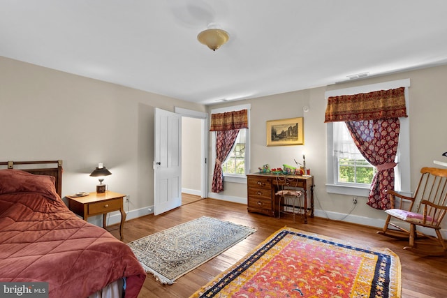 bedroom with hardwood / wood-style floors