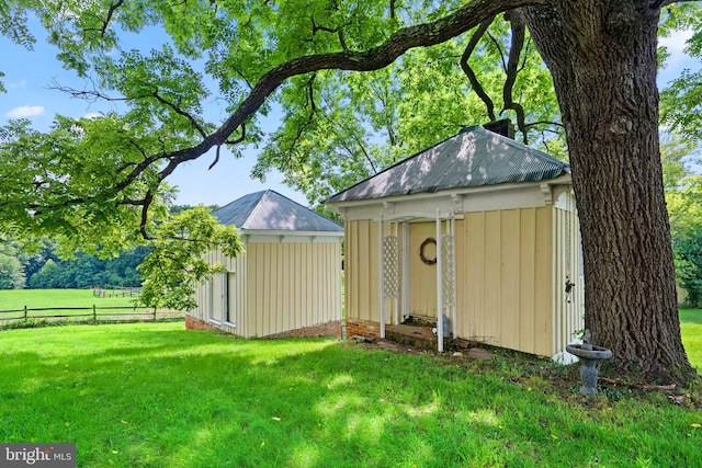 view of shed / structure with a lawn