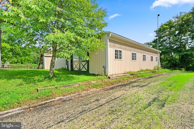 view of property exterior featuring a yard