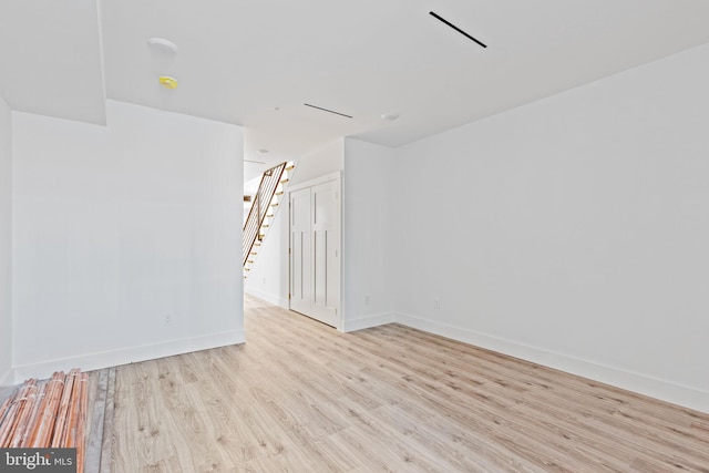 empty room with light wood-type flooring