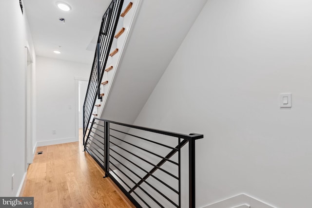 staircase featuring hardwood / wood-style floors