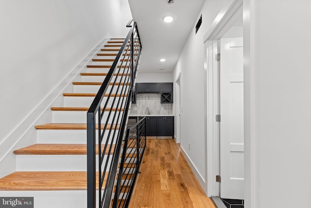 stairway with wood-type flooring