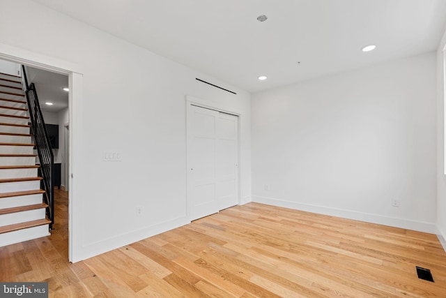 unfurnished room featuring light hardwood / wood-style flooring