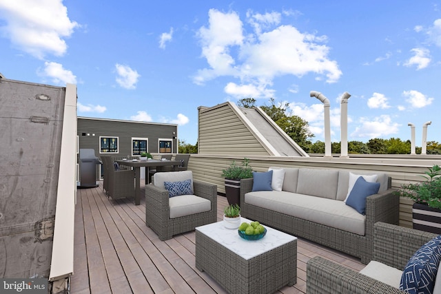 wooden deck featuring an outdoor hangout area