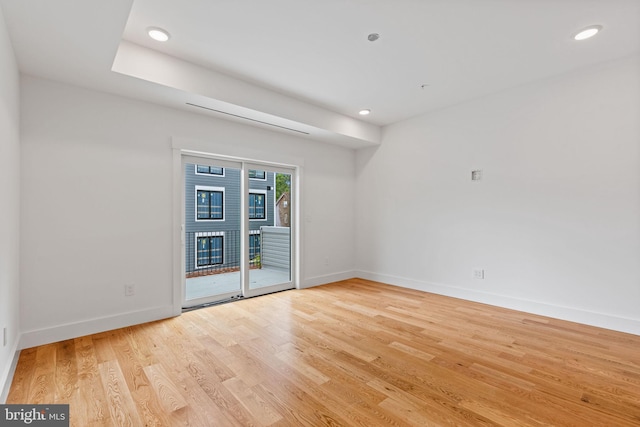 spare room with light wood-type flooring