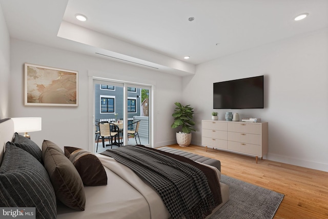 bedroom featuring access to outside and light wood-type flooring