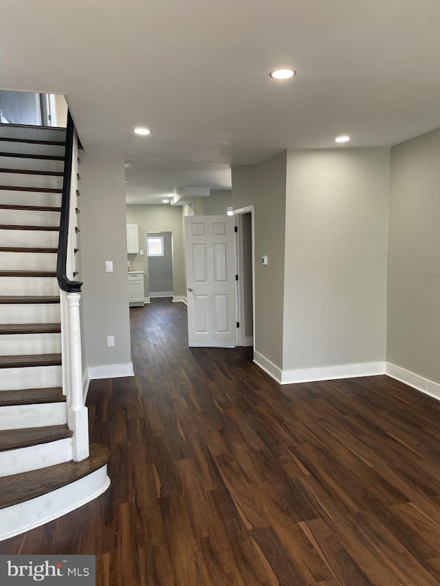 empty room with dark wood-type flooring