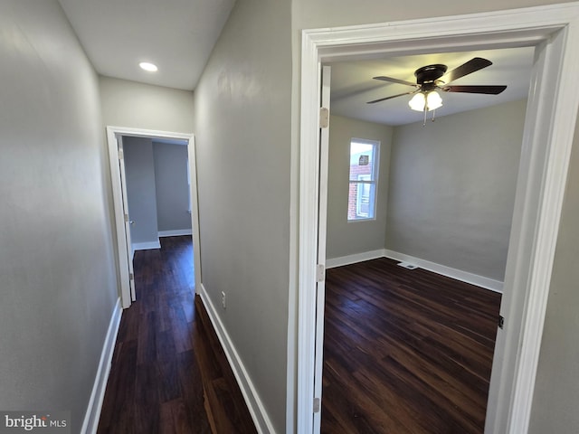 corridor featuring dark hardwood / wood-style floors