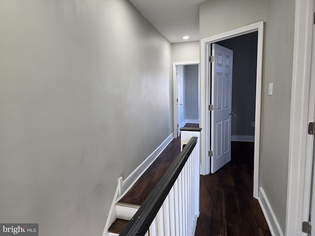 hallway with dark wood-type flooring