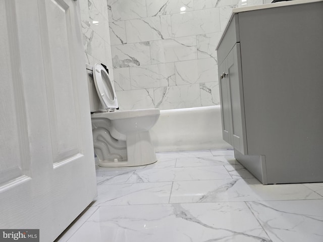 bathroom with tile floors and toilet