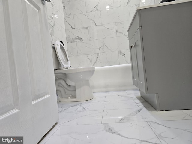 bathroom featuring tiled shower / bath combo and tile flooring