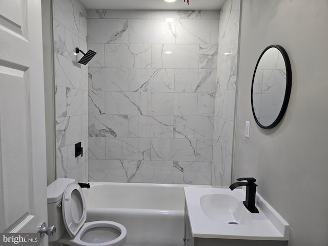 full bathroom featuring tiled shower / bath combo, toilet, and oversized vanity