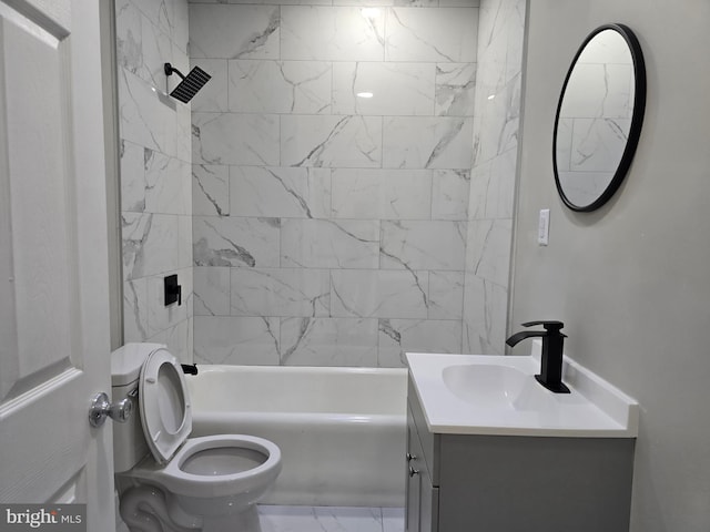 full bathroom featuring toilet, tile flooring, tiled shower / bath combo, and vanity