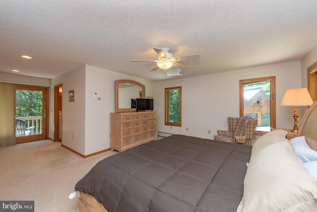 bedroom with access to outside, multiple windows, carpet floors, and ceiling fan