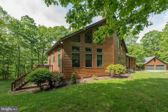 view of home's exterior with a lawn and a garage