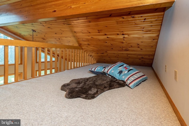 carpeted bedroom with wood ceiling and vaulted ceiling