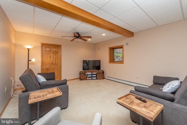 carpeted living room with ceiling fan and a baseboard radiator