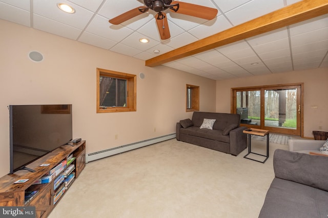 carpeted living room with baseboard heating, a drop ceiling, and ceiling fan