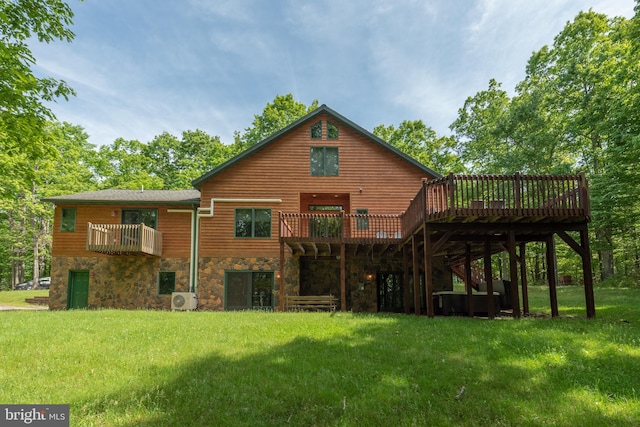 rear view of property with ac unit, a deck, and a yard