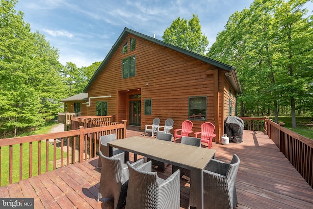 wooden terrace with a grill