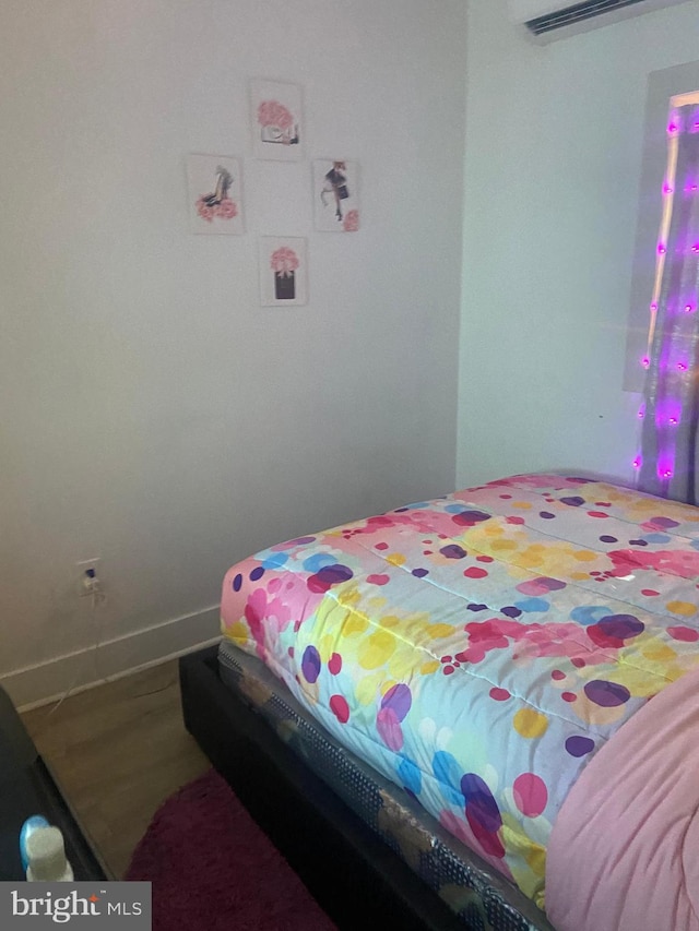 bedroom featuring wood-type flooring