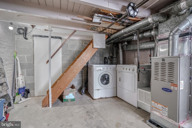 basement with heating utilities and separate washer and dryer