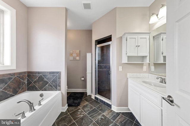 bathroom featuring tile floors, oversized vanity, and independent shower and bath