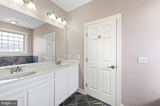 bathroom with tile flooring, large vanity, and double sink