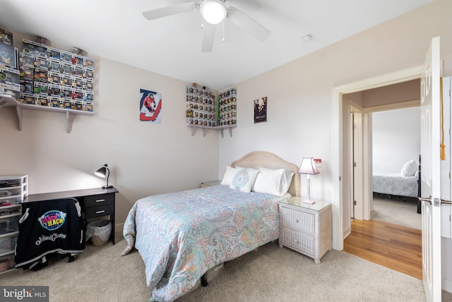 bedroom featuring light hardwood / wood-style flooring and ceiling fan