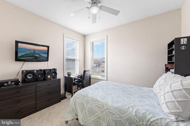 bedroom with light colored carpet and ceiling fan