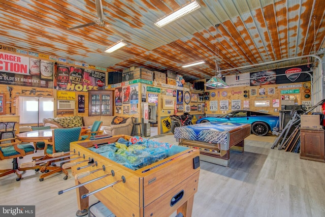 game room featuring ceiling fan and light hardwood / wood-style flooring