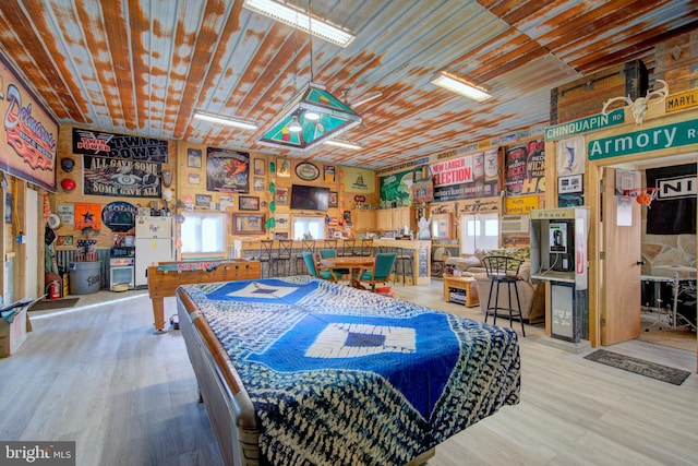 recreation room featuring light wood-type flooring