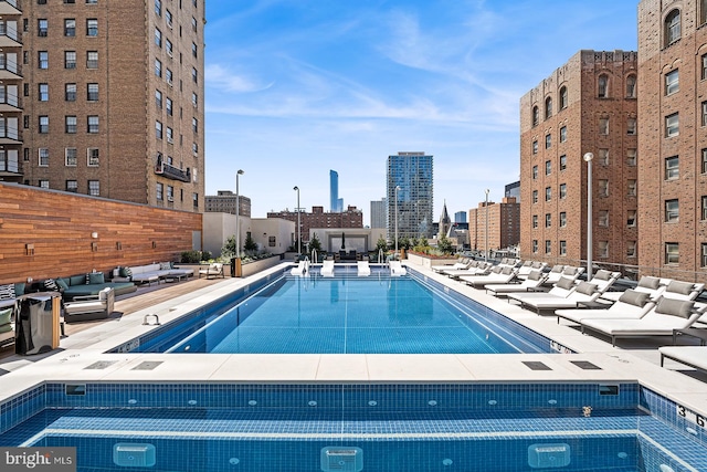 view of swimming pool with a patio