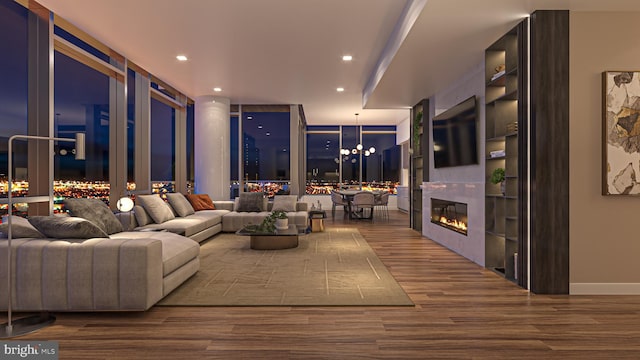 living room with a notable chandelier and dark wood-type flooring