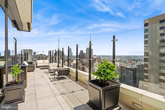 view of terrace with a balcony and outdoor lounge area