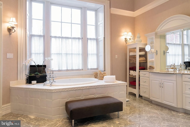 bathroom featuring vanity and a relaxing tiled tub