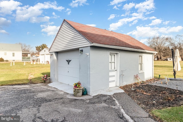 garage featuring a yard