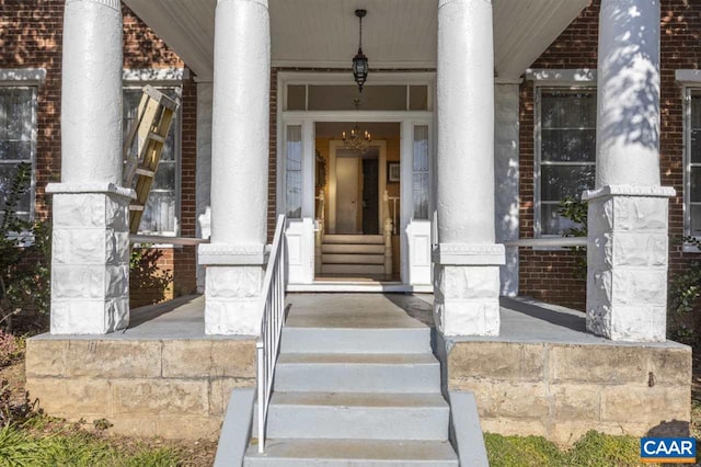 entrance to property featuring covered porch