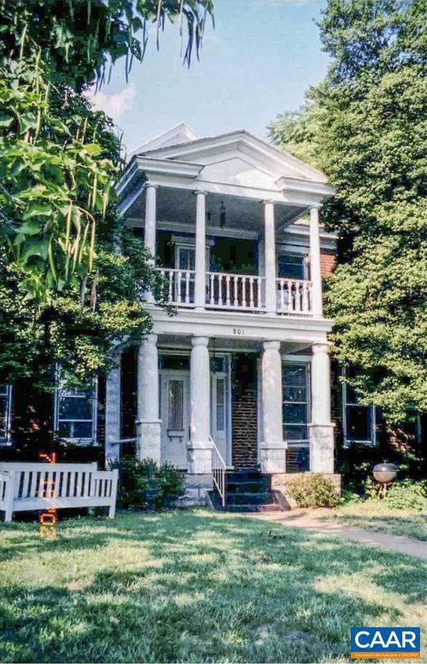 neoclassical / greek revival house featuring a balcony and a front yard