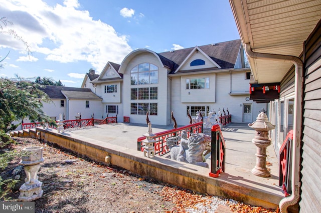 back of property with a patio