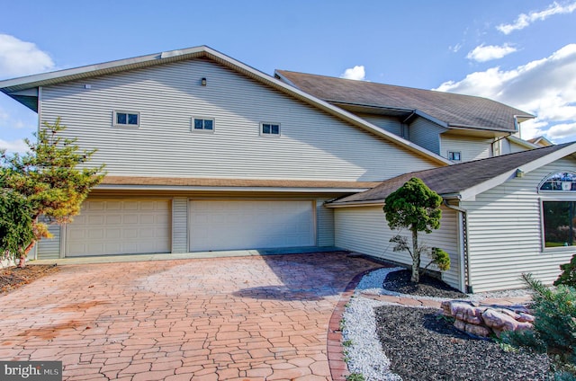 view of front of home with a garage