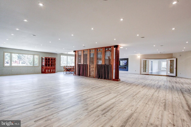 unfurnished living room featuring light hardwood / wood-style floors