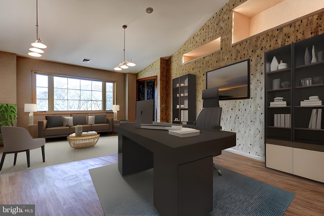 interior space featuring dark hardwood / wood-style flooring and high vaulted ceiling