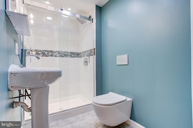 bathroom featuring tile flooring, tiled shower, and toilet