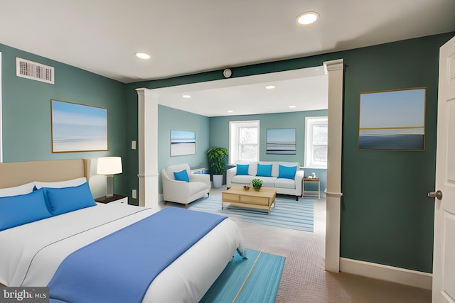 carpeted bedroom featuring ornate columns