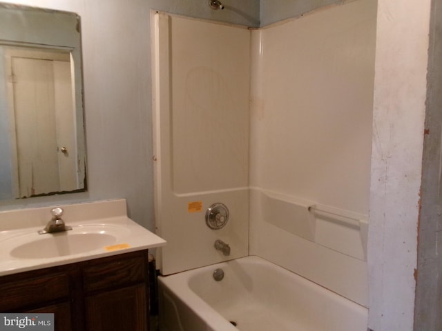 bathroom featuring shower / washtub combination and vanity