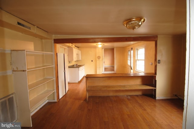 kitchen featuring white refrigerator and light hardwood / wood-style flooring