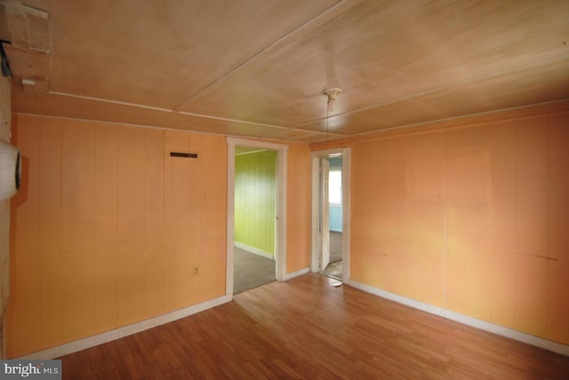 spare room with light hardwood / wood-style flooring