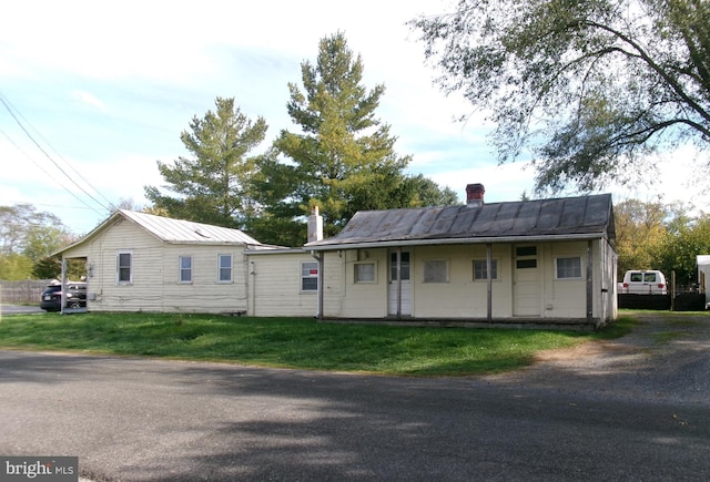 exterior space featuring a front lawn