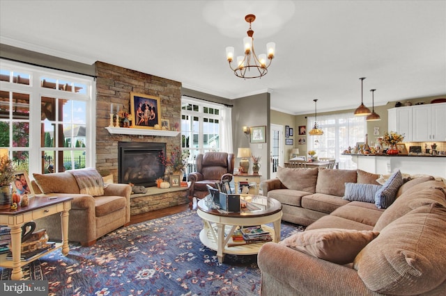 living room with a chandelier, a healthy amount of sunlight, and dark hardwood / wood-style flooring